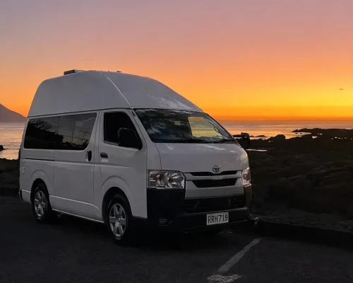Campervan at sunset by the coast (1)